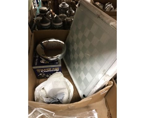 A box containing a modern glass chess set, a quantity of vintage household linens, a DVD set "The Golden Age of Comedy" to in