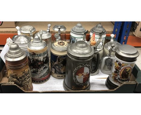 A large collection of assorted steins to include musical versions, together with a blackamoor moneybox (2 boxes) Notice from 