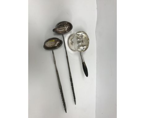 A George III silver toddy ladle with twisted whalebone handle (by Thomas Morley, London 1781), 39 cm long, together with anot