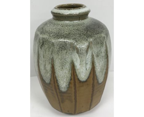 A Phil Rogers ash and salt glazed faceted vase, raised on circular foot, bearing impressed mark, 20.5 cm high (ARR) CONDITION