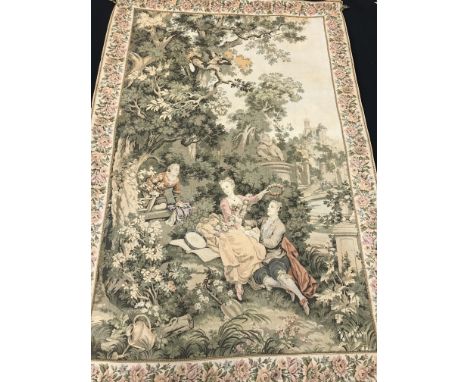 A tapestry panel of a romantic couple in a pleasure garden with border of pink flowers on a hanging rail with fleur de lys fi
