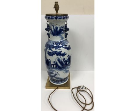 A Japanese blue and white vase converted to lamp, with dog of Fo style handles, raised on a metal base, 61 cm high excluding 