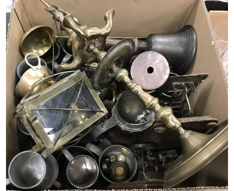 A box of assorted metal wares to include various pewter tankards, two sets of postal scales and various weights, a vintage ha