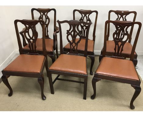 A set of five circa 1900 mahogany Provincial Chippendale style dining chairs with fretwork carved back splats and drop-in sea