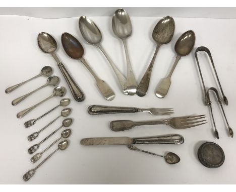 A collection of various 19th Century and later cutlery including sugar tongs, two "Fiddle" pattern spoons, "Fiddle and Thread