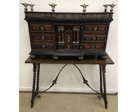 A 19th Century Spanish table top cabinet in rosewood with satinwood strung medallion and tortoiseshell panel decoration, in t