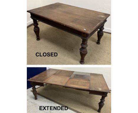 A Victorian mahogany extending occasional table in the Gothic revival style, the rectangular top with moulded edge over a pla