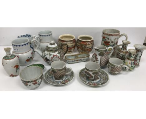 A collection of Chinese and Japanese Imari and other porcelain wares to include a Chinese armorial decorated part tea set com