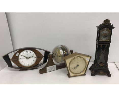 A box containing a West German wall mounted Sputnik type barometer/weather station, a Metamec electric mantel clock, a Smiths