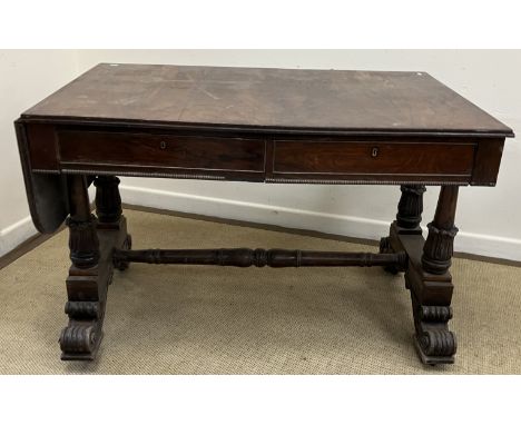 A Victorian rosewood drop-leaf sofa table, the rounded rectangular top with reeded edge over two frieze drawers, on petal car