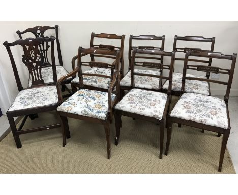 A collection of four 18th Century mahogany Provincial Chippendale style dining chairs with carved back splats and drop-in sea
