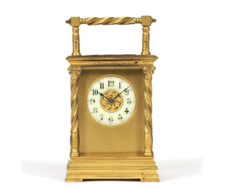 A LATE 19TH CENTURY FRENCH CARRIAGE CLOCK with Gothic enamel chapter ring, foliate disc centre and gilt mask, silvered platfo