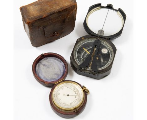 A 19TH CENTURY GILT METAL POCKET BAROMETER, with silvered dial, 4.7cm diameter, in fitted leather case; and a WWII military c