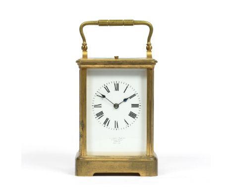 A LATE 19TH CENTURY FRENCH CARRIAGE CLOCK with white enamel Roman dial, inscribed 'Goldsmiths Company, 112 Regent Street, Lon