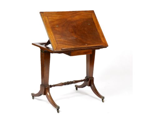 A REGENCY MAHOGANY RECTANGULAR READING TABLE with hinged top and strut support, tapering end columns, ring turned stretcher a