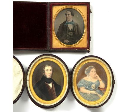 A PAIR OF 19TH CENTURY HAND-TINTED PORTRAIT PHOTOGRAPHS by Lock and Whitfield of Mr &amp; Mrs Iltid Thomas in Morocco leather