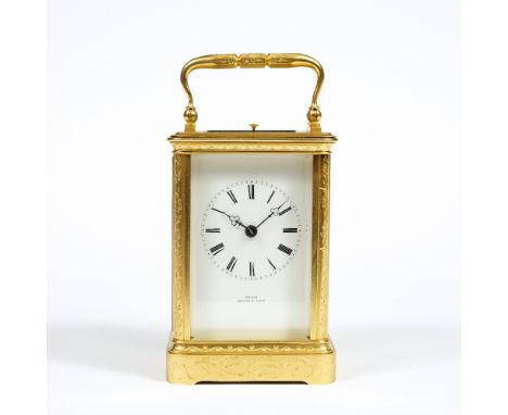 A LATE 19TH CENTURY FRENCH CARRIAGE CLOCK, the white enamel Roman dial with trefoil hands, signed Ellis, Exeter and Paris rep