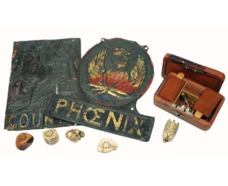 TWO 19TH CENTURY EMBOSSED FIRE MARKS, for Phoenix and County; a collection of five various Japanese netsuke, a gilt metal wat