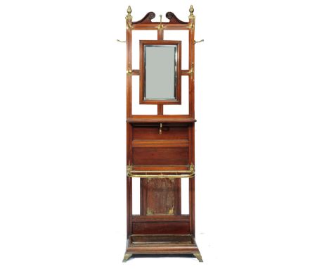 A LATE VICTORIAN MAHOGANY AND BRASS HALL STAND, with mirror inset back above a shelf and stick stand below, 54.5cm