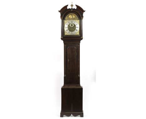 AN OAK EIGHT DAY LONGCASE CLOCK, the 13" brass break arch dial with silvered Roman chapter ring, Arabic five minutes, foliate