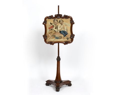 A VICTORIAN MAHOGANY POLE SCREEN, the banner with scroll carved frame and of cartouche shape incorporating a tapestry woven w