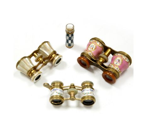 A PAIR OF LATE 19TH CENTURY FRENCH GILT METAL AND ENAMEL OPERA GLASSES, painted with 'jewelled' reserves of flowers on a pink