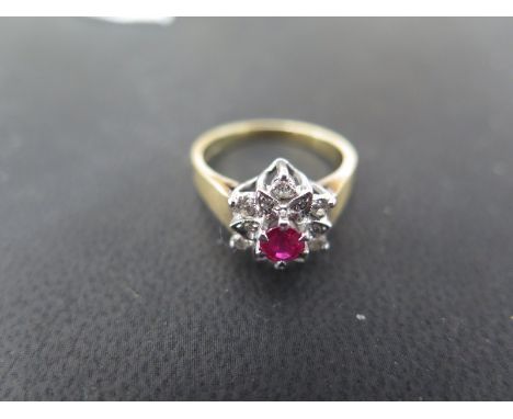 An 18ct gold diamond and ruby cluster ring - size L - Weight approx. 4 grams - stones bright, some usage marks 