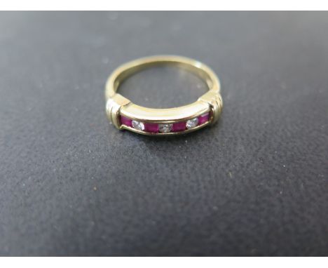 An 18ct yellow gold diamond and ruby ring - size O - Weight approx. 4grms - stones bright, minor usage marks 