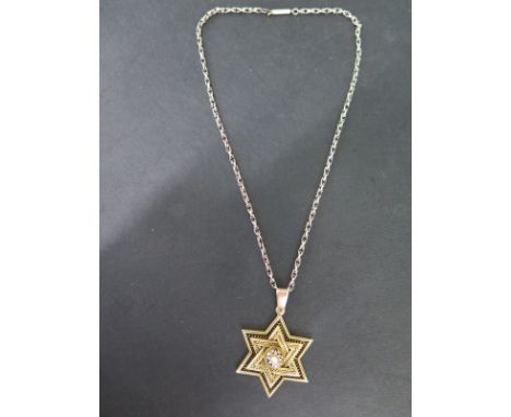 A gilt metal Star of David pendant with enamel and pearl centre with later pendant mount on a gold chain - pendant 35mm wide 