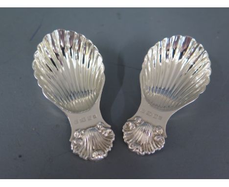 A pair of shell shaped silver caddy spoons Birmingham 1982 maker PHV and Co - approx weight 1.3 troy oz - in good condition