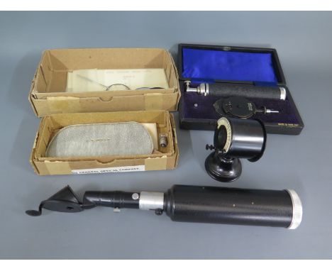 A collection of Scientific Optical Ophthalic equipment, includes a May Ophthalmoscope in original box, a Macula Retinoscope a