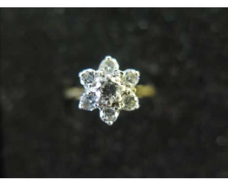 A pretty 18ct diamond cluster ring size K - approx weight 2.5 grams - diamonds bright, inclusions to all, slight usage wear