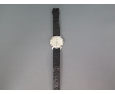 A gentleman's Omega wristwatch in stainless steel case the silvered dial with baton markers and centre sweep seconds, case di