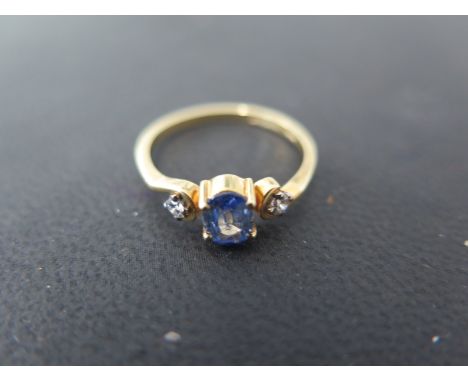 An 18ct yellow gold tanzanite and diamond ring size L - approx weight 2 grams - stones bright, good overall condition, light 