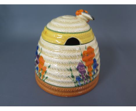 A Clarice Cliff Bizarre Crocus design preserve pot - Height 9cm - no obvious damage or repair, minor colour loss