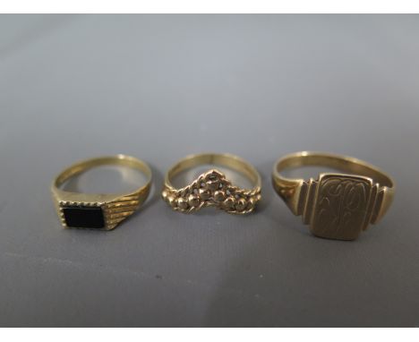 Three 9ct yellow gold rings including a signet ring sizes S and two K - total approx weight 6 grams - all rings in good order
