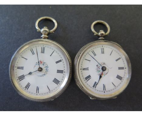 Two silver cased Ladies pocket watches both with white enamel dials, both with Roman numerals to chapter rings, both have flo