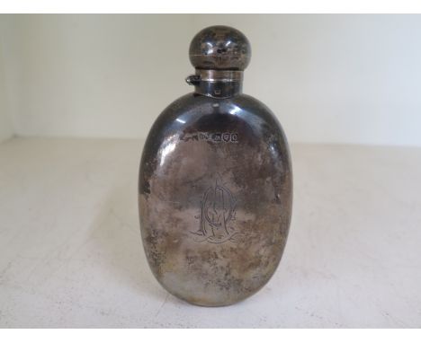 A Victorian hallmarked silver hip flask with secure twist lock lid hallmarked London 1898, makers stamp HA for Atkin Borthers