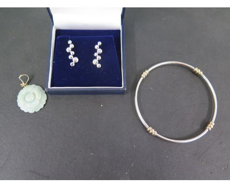 A 9ct gold and silver bangle and a Jade and gold pendant and silver and diamond drop earrings 