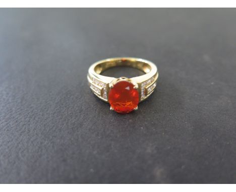 An 18ct yellow gold fire opal and diamond ring Iliana opal approx 1.48ct - diamonds approx 0.36ct - ring size O - total weigh