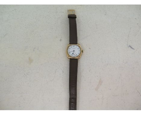 A Gentleman's 9ct yellow gold cased wristwatch by Waltham U.S.A. Arabic numerals to white enamel dial with subsidiary second 