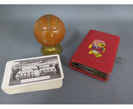 Football Interest - A World Cup Willie 1966 money box with key, a football desk stand and a full pack of Cambridge United sea