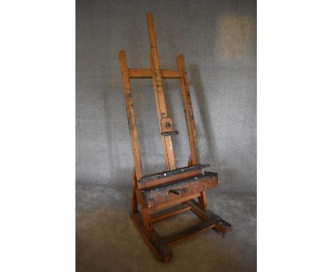 An adjustable and articulated beech framed  professional artist's easel. H. 193 x 74cm (Property of the late Jacqueline Morre