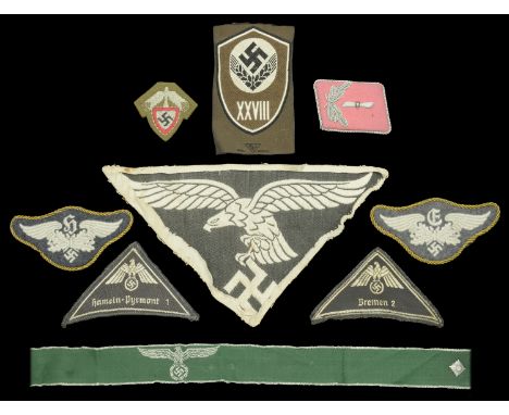 German Second World War Mixed Insignia. Comprising two mint unissued condition RAD enlisted ranks M.43 cap insignia; a Custom