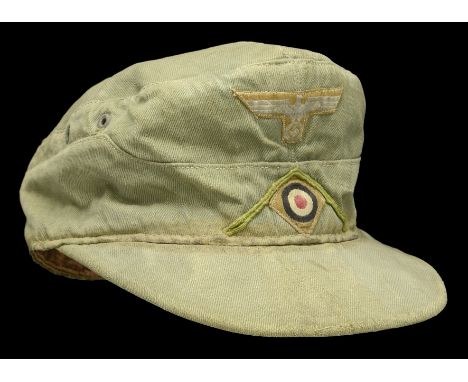 A German Second World War Afrika Korps 1st Pattern Field Cap. A service worn stained and lightly bleached size 56 1940 dated 