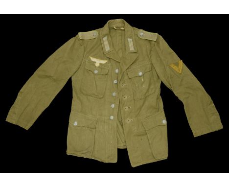 A German Second World War Army 2nd Pattern Tropical Tunic. A medium size tropical tunic, this is the later pattern without pl