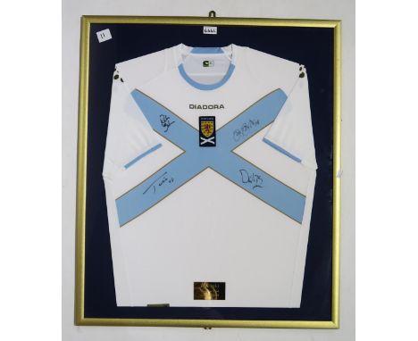 MUSIC/SPORTING MEMORABILIA A framed 2007-08 Scotland away football shirt, signed by the members of Bon Jovi on the occasion o