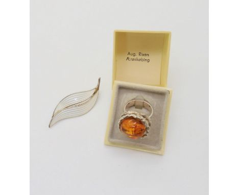 A silver and enamel Aksel Holmsen leaf brooch and a Danish retro silver and amber ring in original box Condition Report:Not a