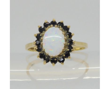 A 9ct gold opal and sapphire cluster ring, size O, weight 1.9gms Condition Report:Available upon request