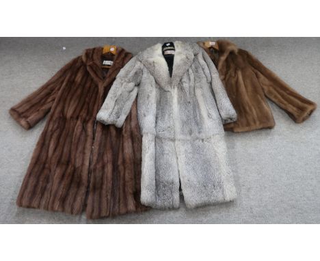 A light grey fur coat a brown fur coat and a jacket Condition Report:Not available for this lot.